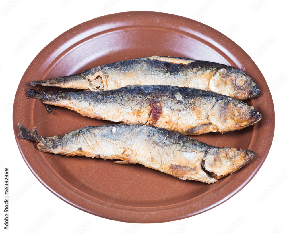 fried sprat on ceramic plate