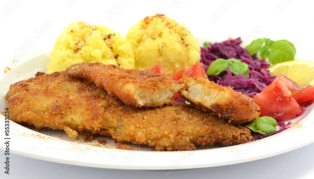 pollock fried with potatoes and vegetables