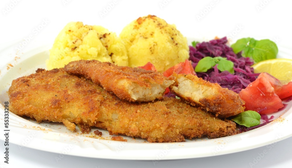 pollock fried with potatoes and vegetables