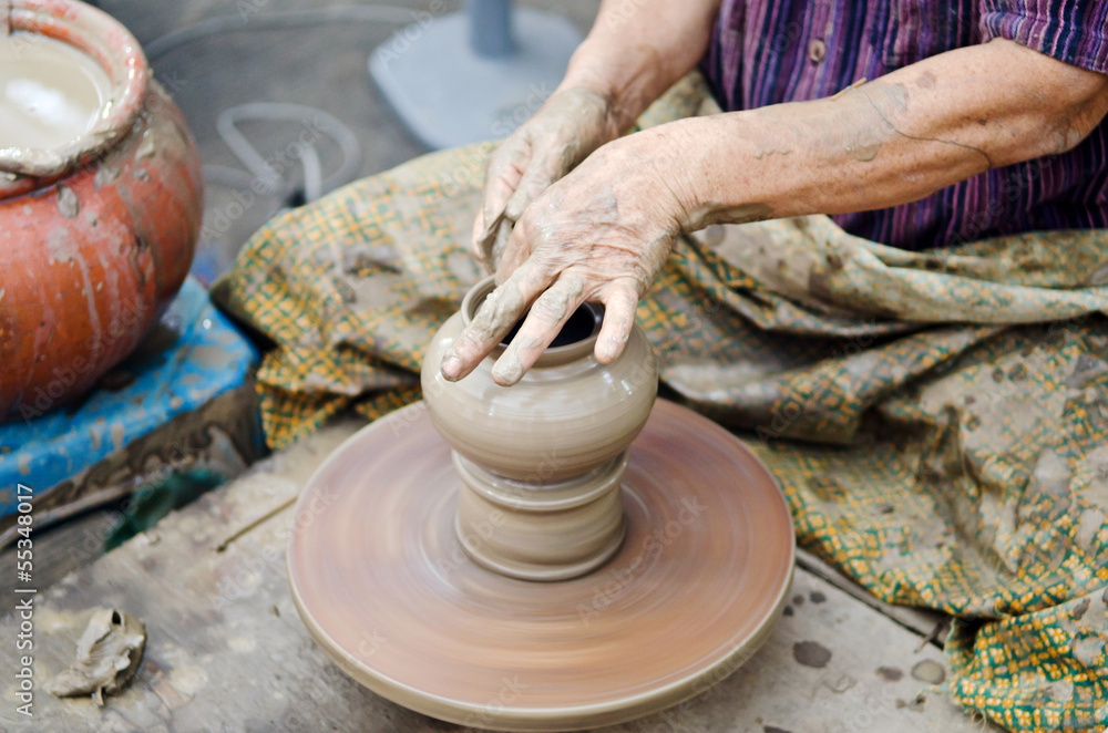 potter man hands shaping ceramic craft