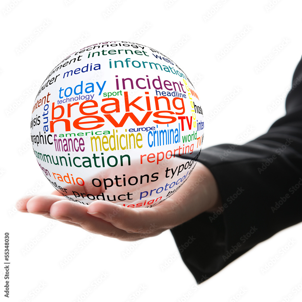 Transparent ball with inscription breaking news in a hand Transparent ball with inscription breaking news in a hand