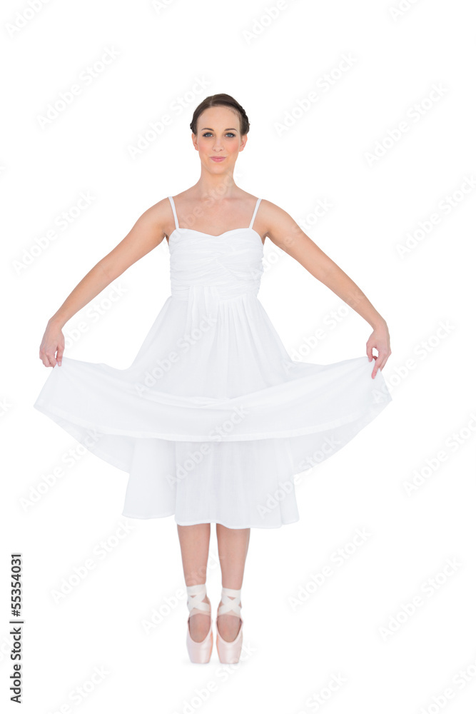 Peaceful young ballet dancer standing on her tiptoes Peaceful young ballet dancer standing on her tiptoes