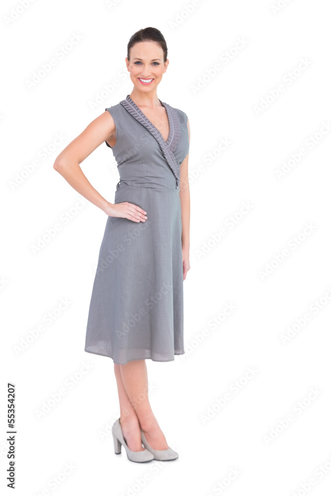 Happy elegant woman in classy dress posing hand on waist Happy elegant woman in classy dress posing hand on waist