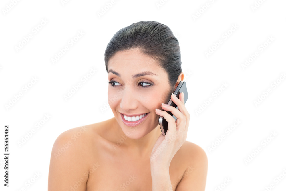 Attractive brunette making a call on smartphone