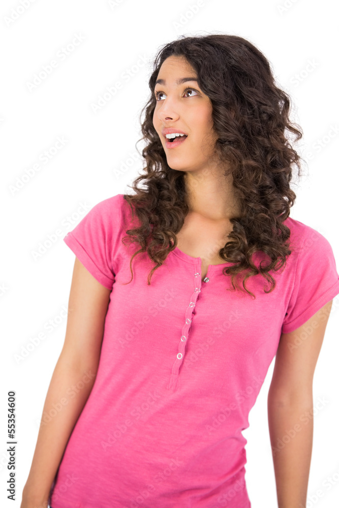 Fototapeta premium Surprised brown haired woman posing looking up
