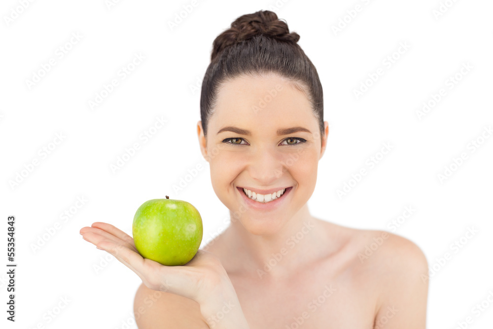 Smiling pretty model holding apple Smiling pretty model holding apple