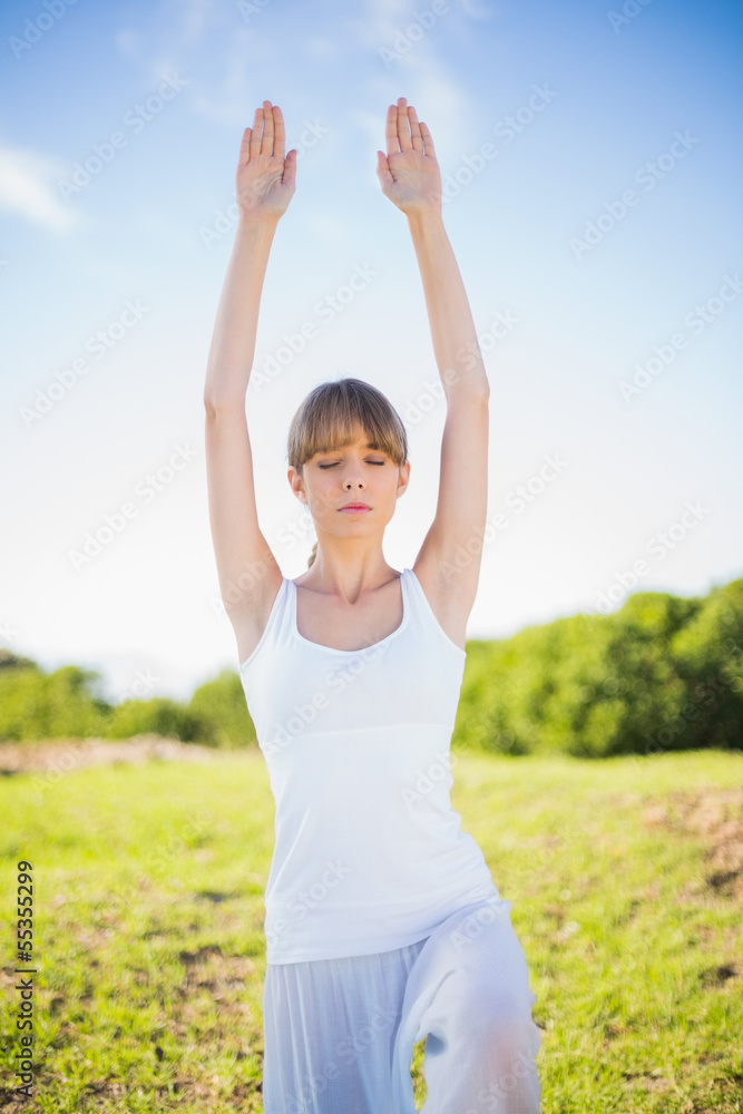Content young woman stretching outside