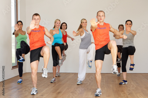 Group Of People Exercising In Dance Studio