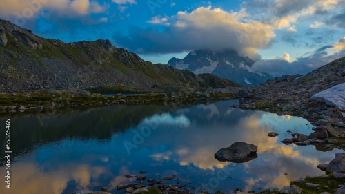 pshish mount reflected in a water at the evening caucasus russia photo