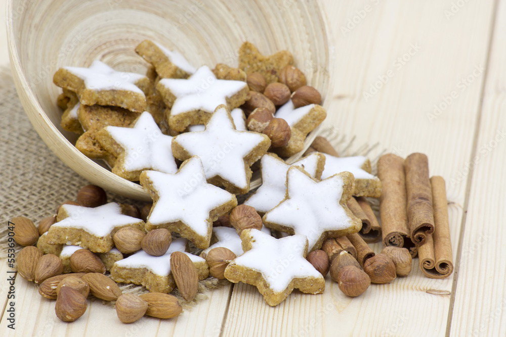 typical christmas cinnamon star cookies, nuts and cinnamon stick typical christmas cinnamon star cookies, nuts and cinnamon stick