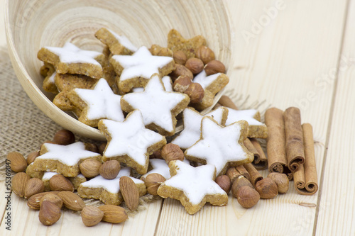 typical christmas cinnamon star cookies, nuts and cinnamon stick