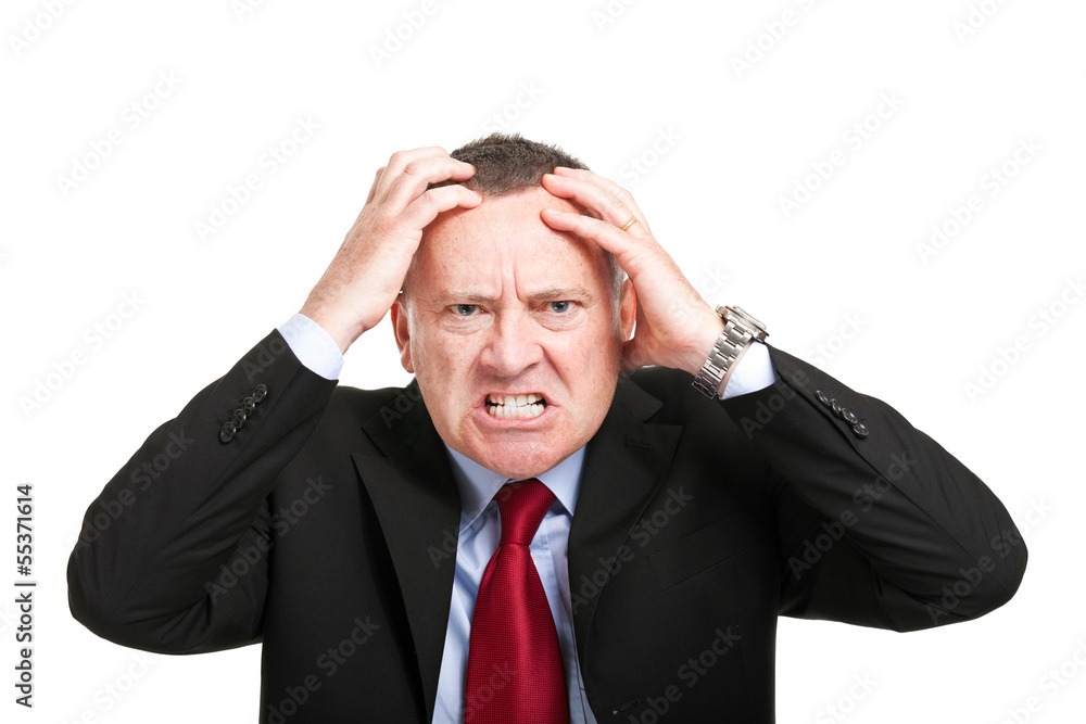 Angry businessman with hands in his head isolated on white Angry businessman with hands in his head isolated on white