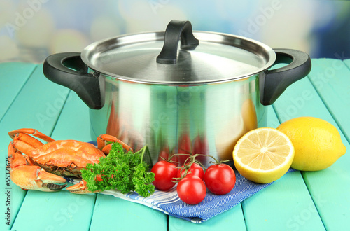 Composition with boiled crab, pan and vegetables