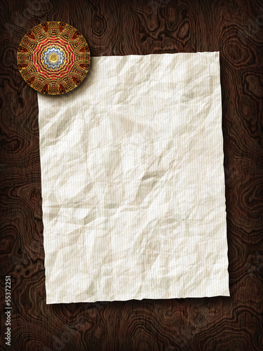 Billede på lærred Paper sheet with paperweight on wooden background texture.