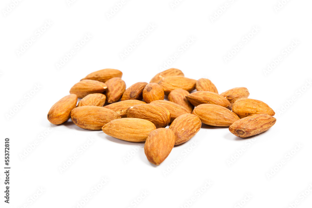 Heap of almond nuts isolated on white background Heap of almond nuts isolated on white background