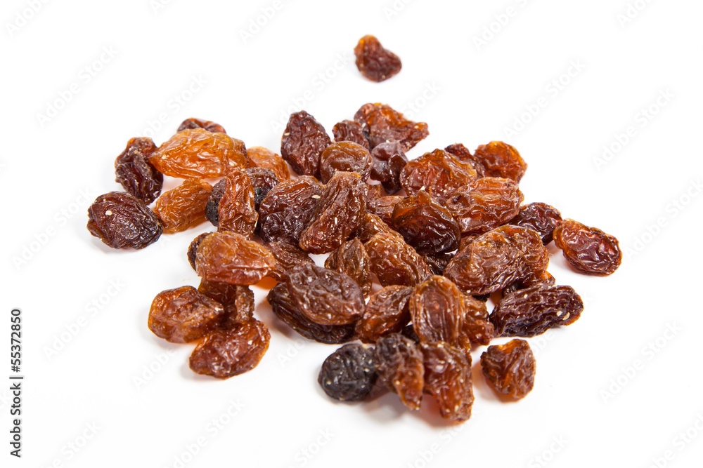 brown raisins on a white background brown raisins on a white background
