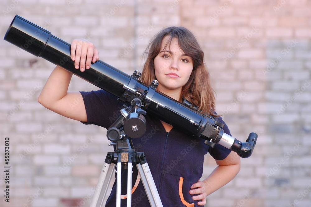 Naklejka premium Teen girl and telescope. Near Kiev,Ukraine