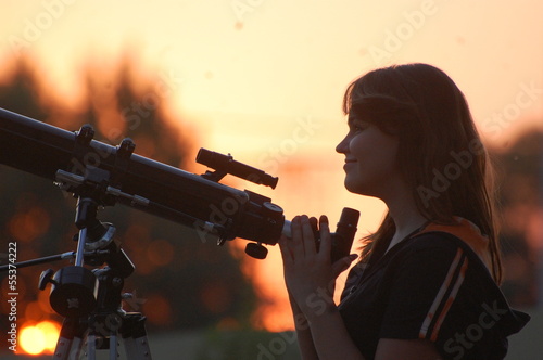 Teen girl and telescope.  Near Kiev,Ukraine