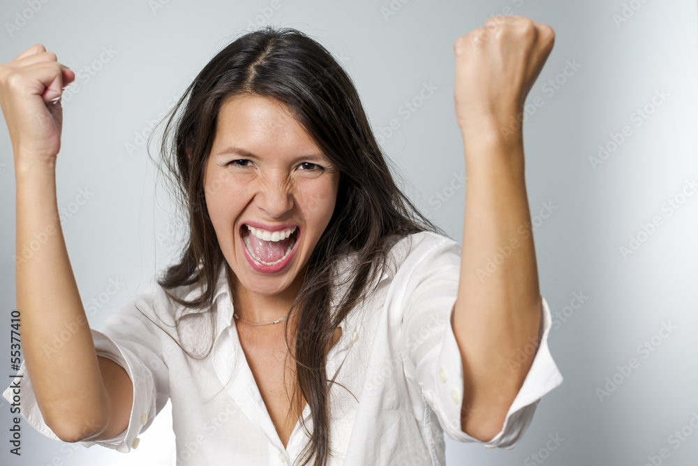 woman cheering with fists in the air woman cheering with fists in the air