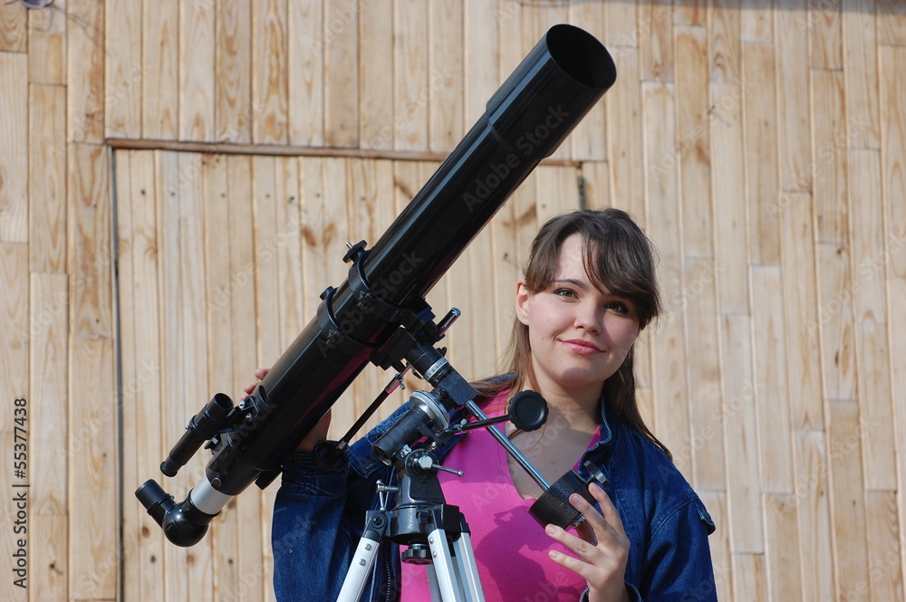 Obraz premium Teen girl and telescope . Near Kiev,Ukraine