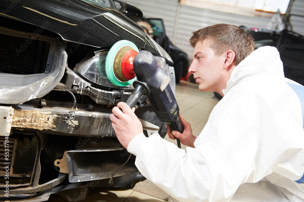 mechanic repairing and polishing car headlight mechanic repairing and polishing car headlight