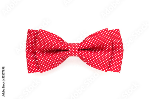 red bow tie with white polka dots isolated on white