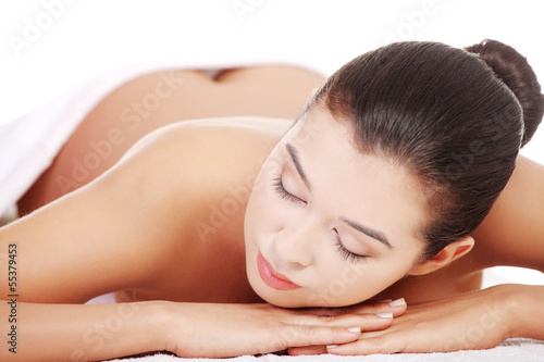 Beauty young woman relaxing in spa.