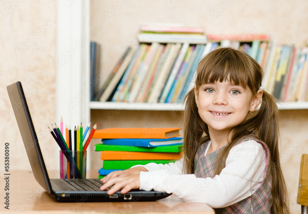 Girl using a laptop computer at school Girl using a laptop computer at school