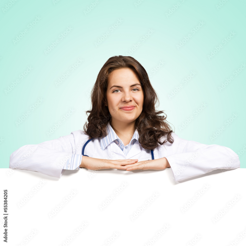 young woman doctor with a blank banner young woman doctor with a blank banner