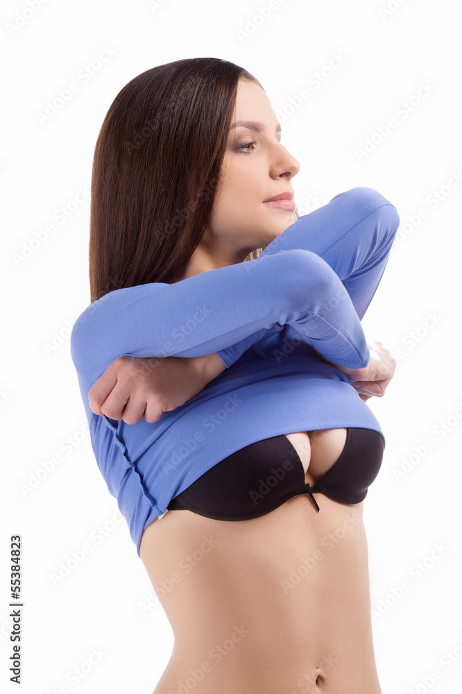 Woman undressing Beautiful young woman undressing while standin Stock Woman undressing Beautiful young woman undressing while standin Stock