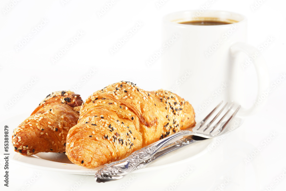 Delicious croissant with a cup of black coffee Delicious croissant with a cup of black coffee