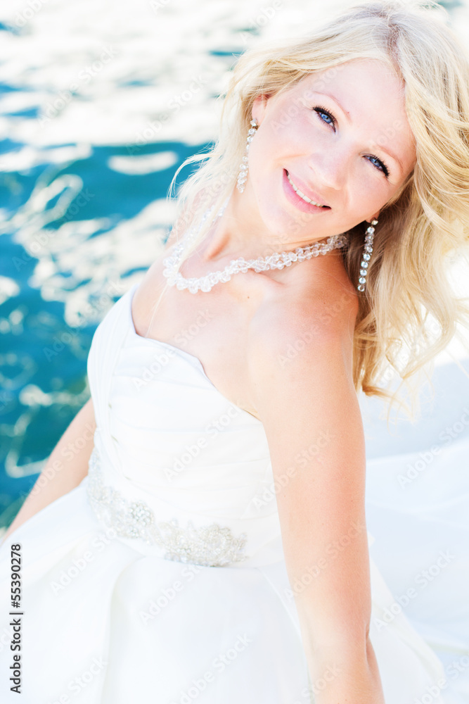 Beautiful bride posing near the sea Beautiful bride posing near the sea