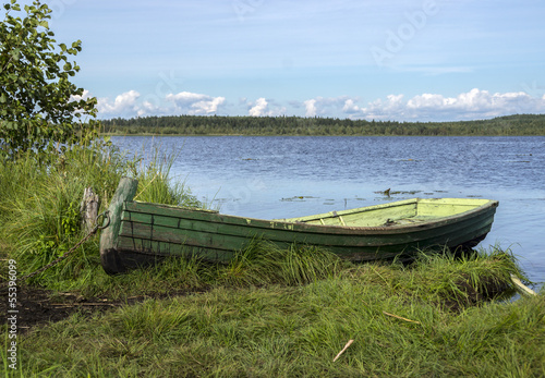 Fishing boat on the lake in summer