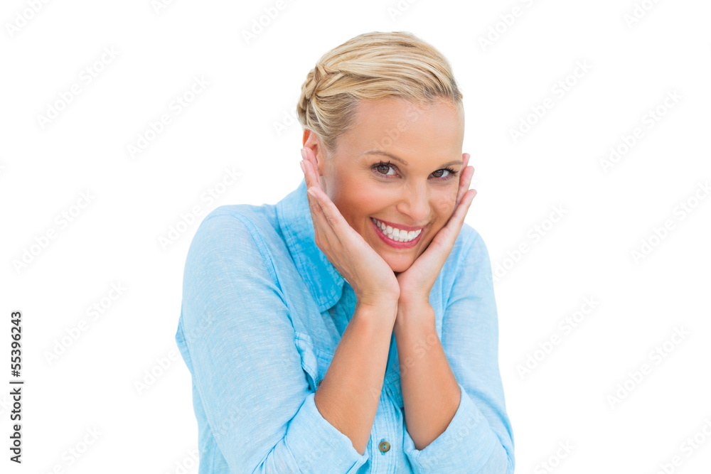 Pretty woman laughing at camera with hands on face Pretty woman laughing at camera with hands on face