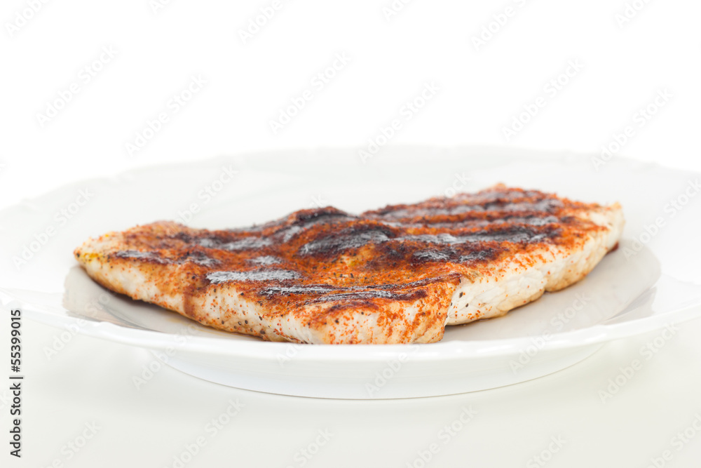 Low-fat chicken filet on white dish Low-fat chicken filet on white dish