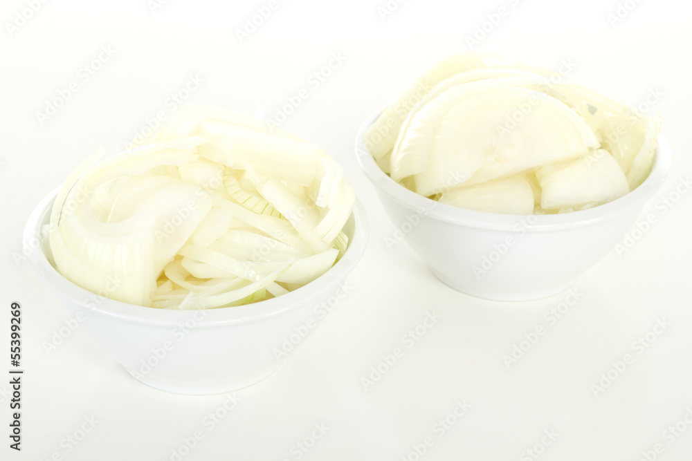 Cutted onions in white bowls Cutted onions in white bowls
