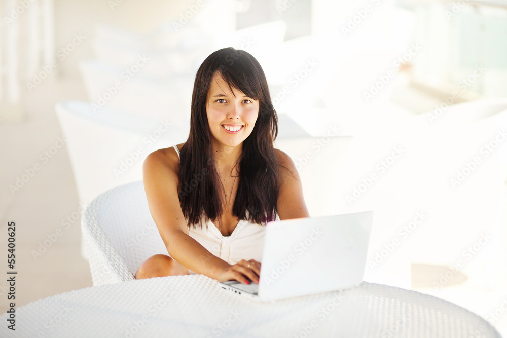 woman relaxing with laptop at home woman relaxing with laptop at home