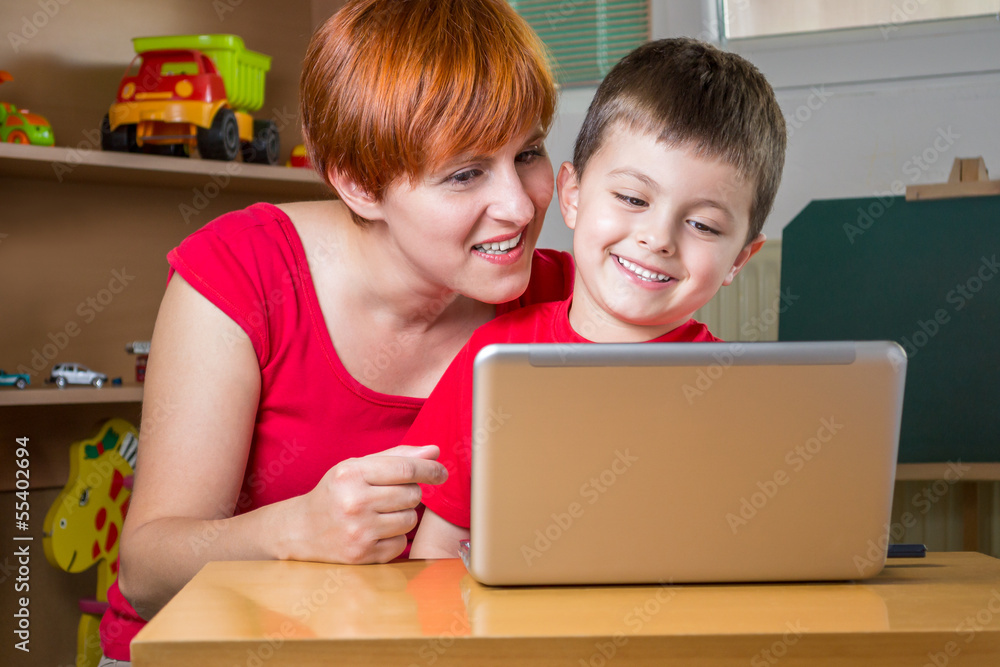 Mother and son with a laptop