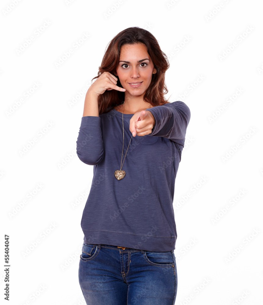 Charming woman gesturing call me sign Charming woman gesturing call me sign