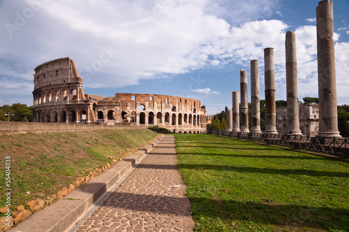 Colosseo and venus temple columns and path view from Roman forum photo