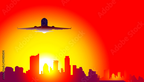 Sunset & airplane on city