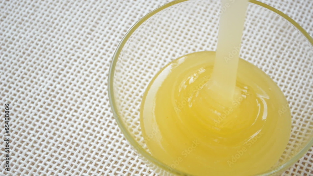 Honey pouring top view Honey pouring top view