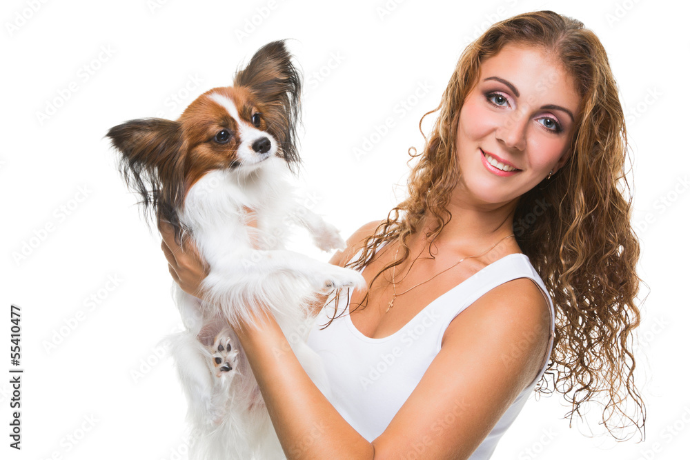 beautiful girl with cute papillon dog on isolated white