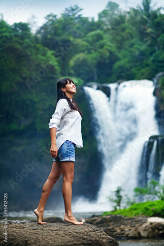 woman near fresh waterfall  bali