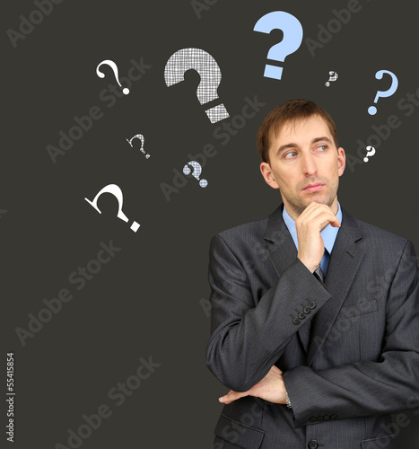 Man thinking surrounded by ...