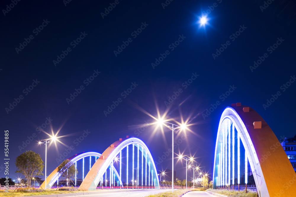 Obraz premium arch bridge with neon lamp