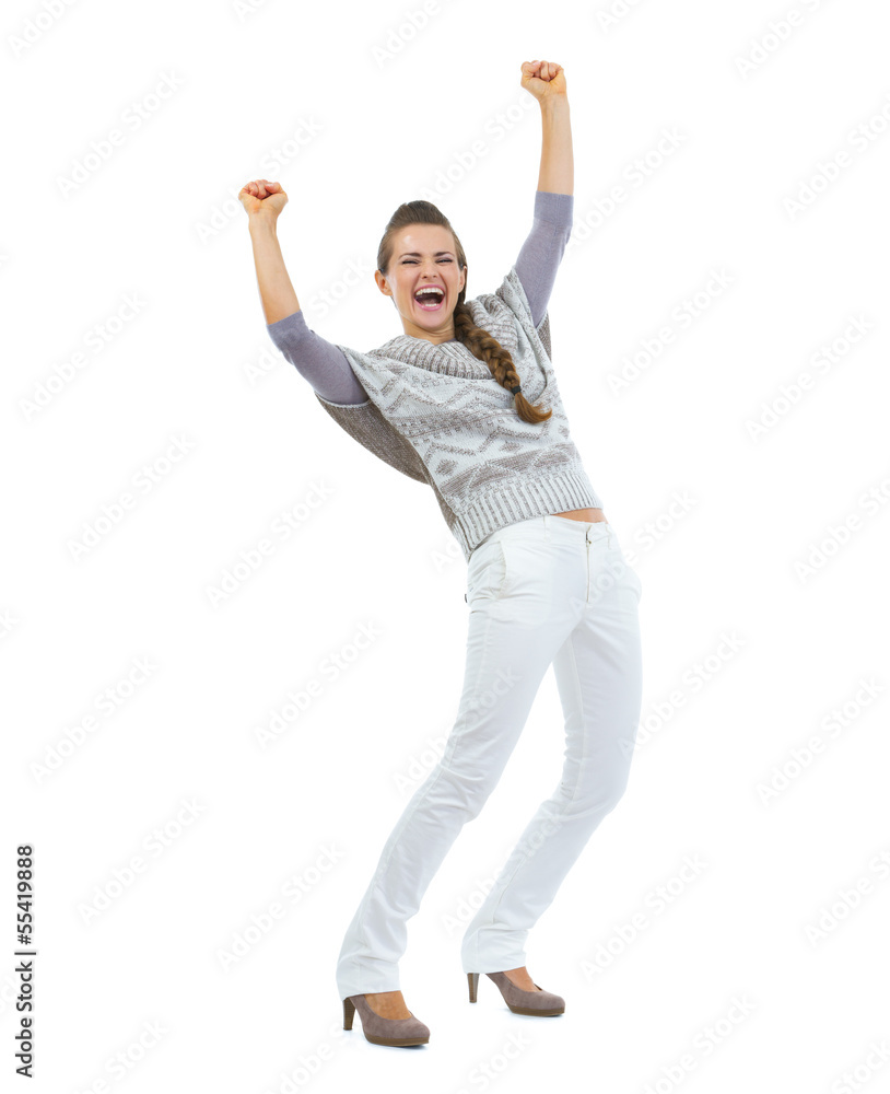 Full length portrait of happy woman in sweater rejoicing success