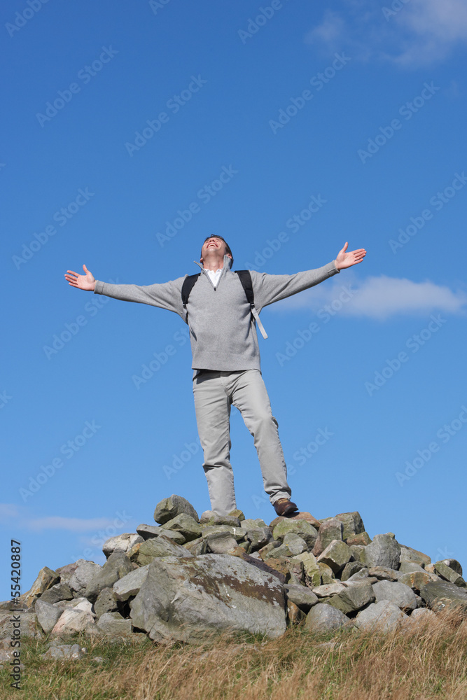 Male Walker Standing On Pile Of Rocks Male Walker Standing On Pile Of Rocks
