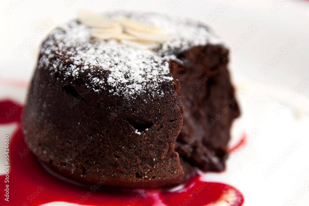 Delicious chocolate fondant with syrup close-up Delicious chocolate fondant with syrup close-up