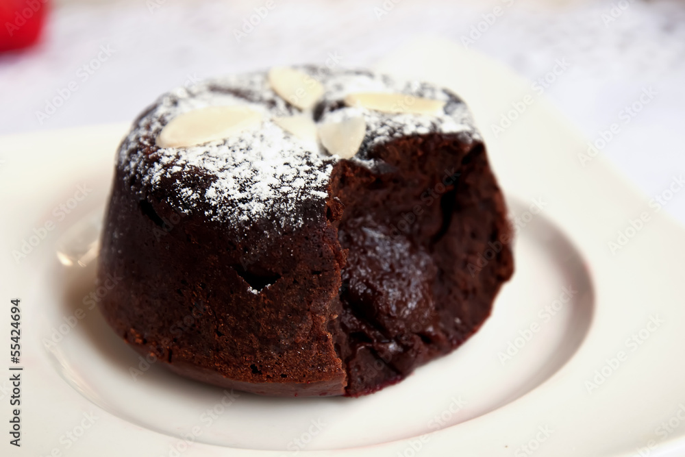 Delicious chocolate fondant with syrup close-up Delicious chocolate fondant with syrup close-up